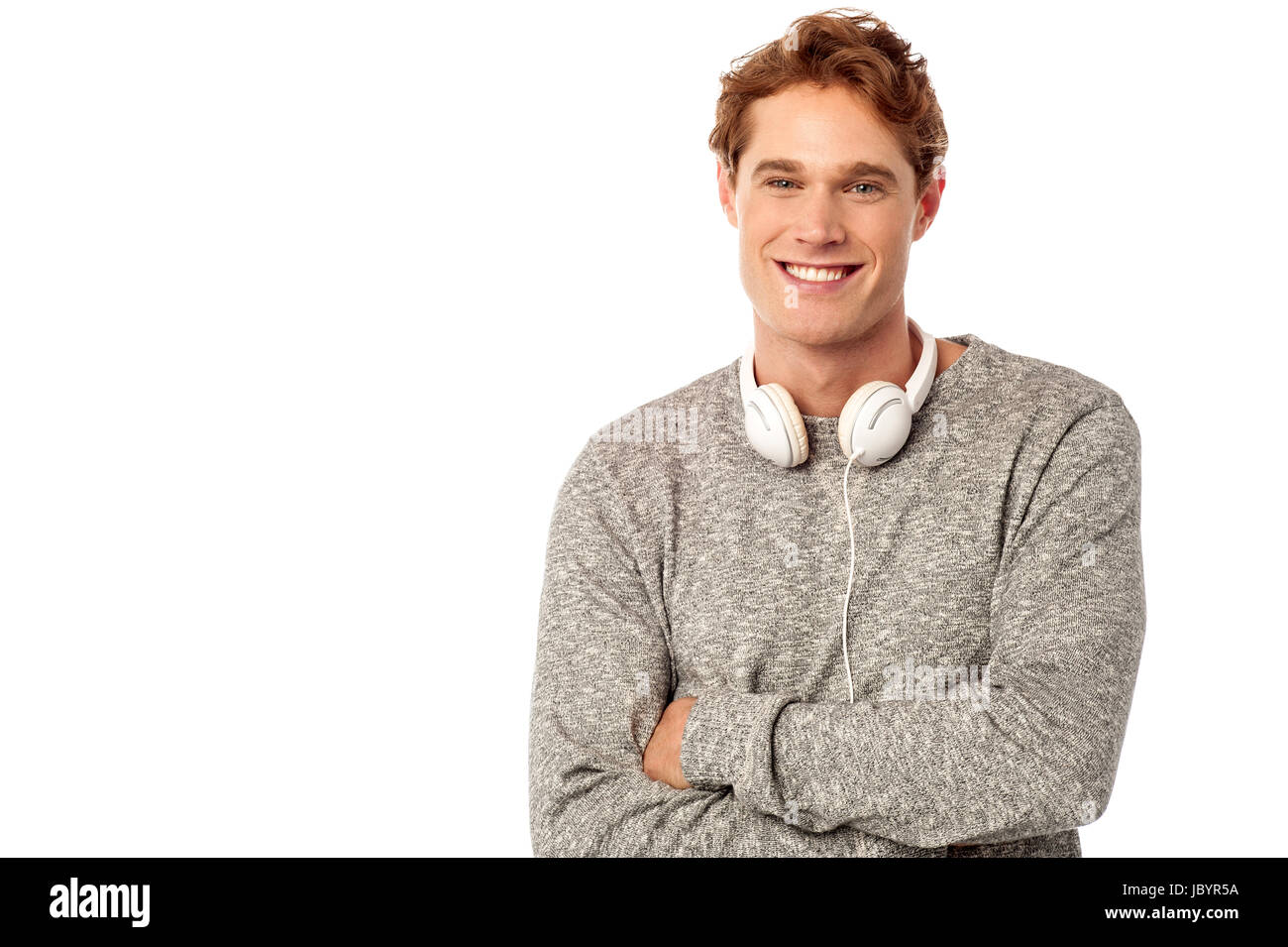 Young man with headphones around his neck hi-res stock photography and ...