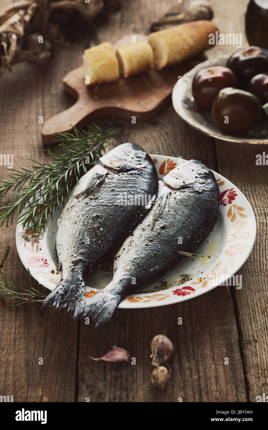 Healthy eating. Bream fish preparation. Seafood with vegetables Stock Photo Alamy