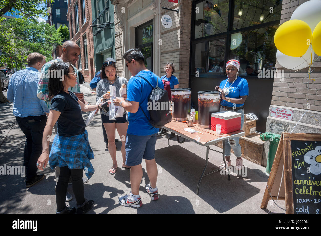 The Grandaisy Bakery in the Tribeca neighborhood of New York celebrates its 10 years in business on Friday, June 9, 2017. The bakers distributed free loaves of their bread and coffee and tea to customers who came by. (© Richard B. Levine) Stock Photo