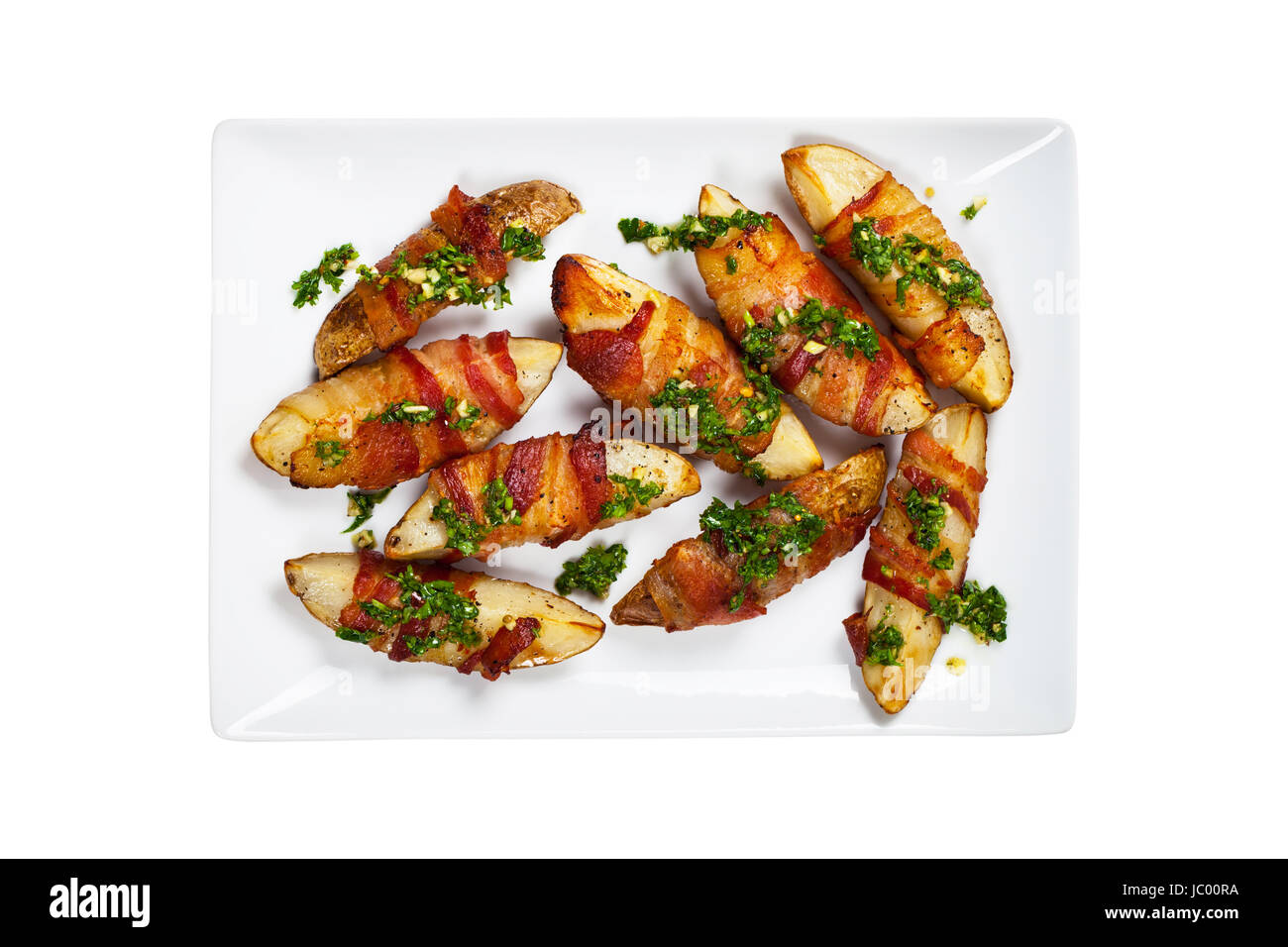 Bacon Wrapped Potatoes Wedges with Parsley Garlic Pesto Sauce Stock