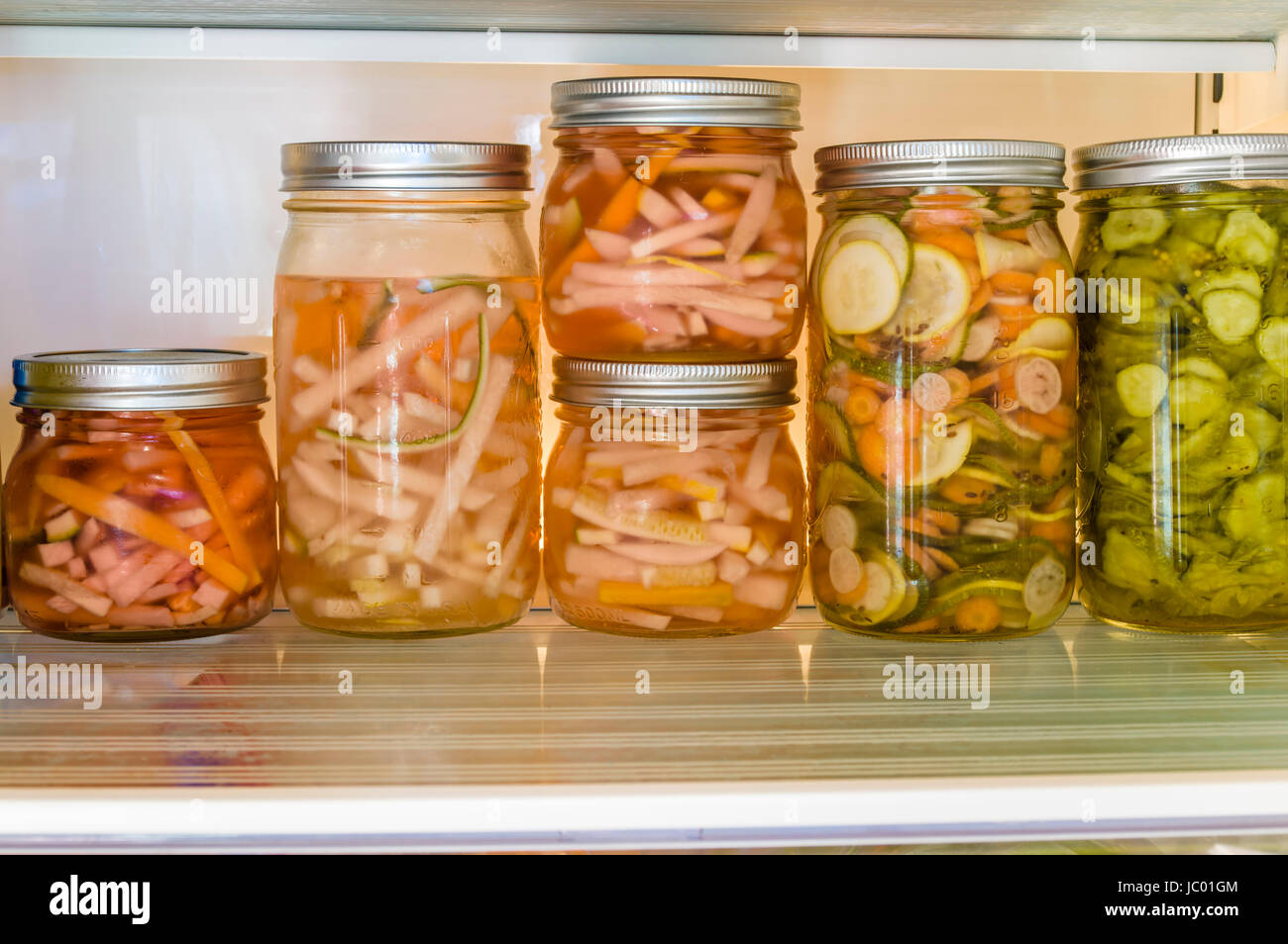 Sliced vegetables being pickled using cold vinegar method Stock Photo