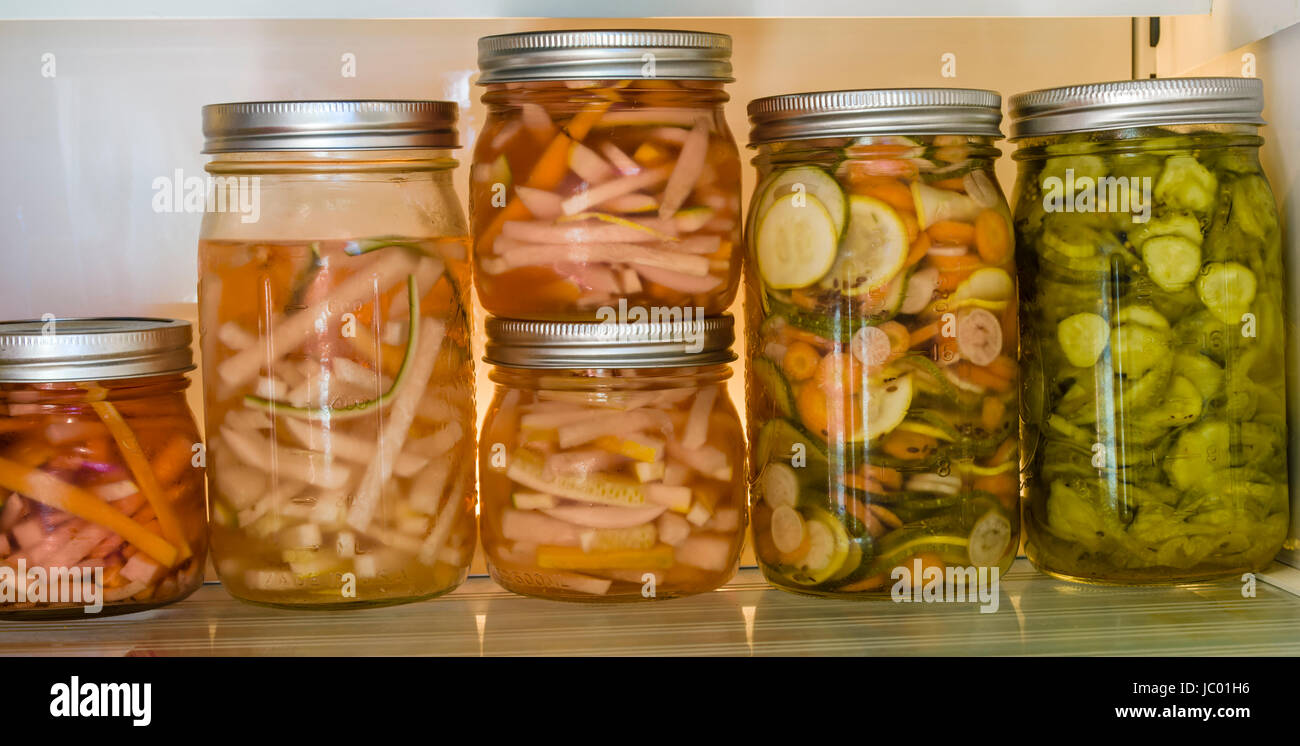 Sliced vegetables being pickled using cold vinegar method Stock Photo