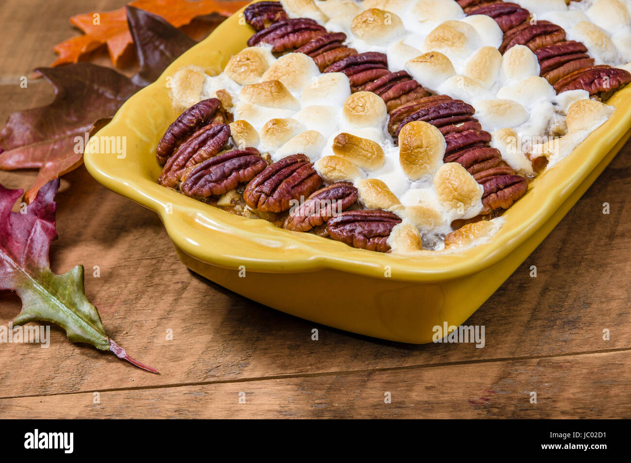 Sweet potato casserole with pecans and marshmallow topping Stock Photo