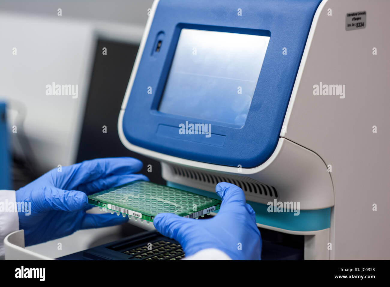 Dna Pcr Lab Scientist or researcher or phd student put dna samples into pcr for ...