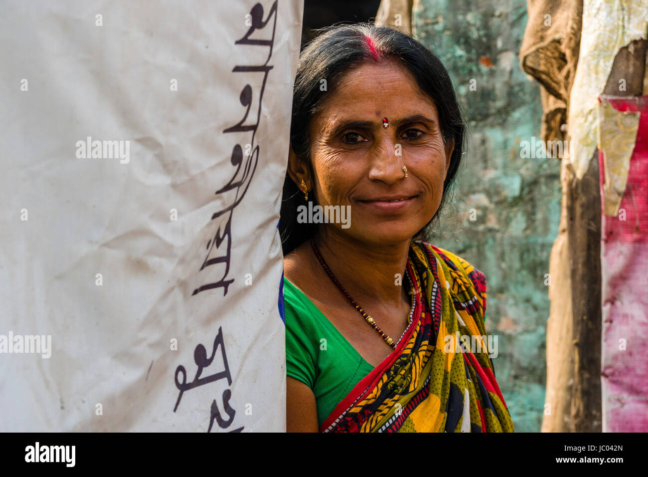 Portrait of a woman who lives in the slum dwellings beside a road in the suburb China Bazar Stock Photo