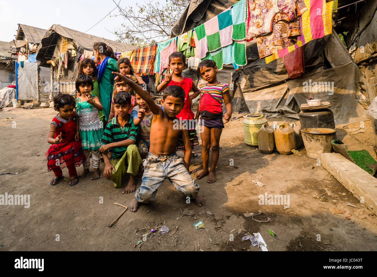 Children are playing between slum dwellings in Topsia slum Stock Photo