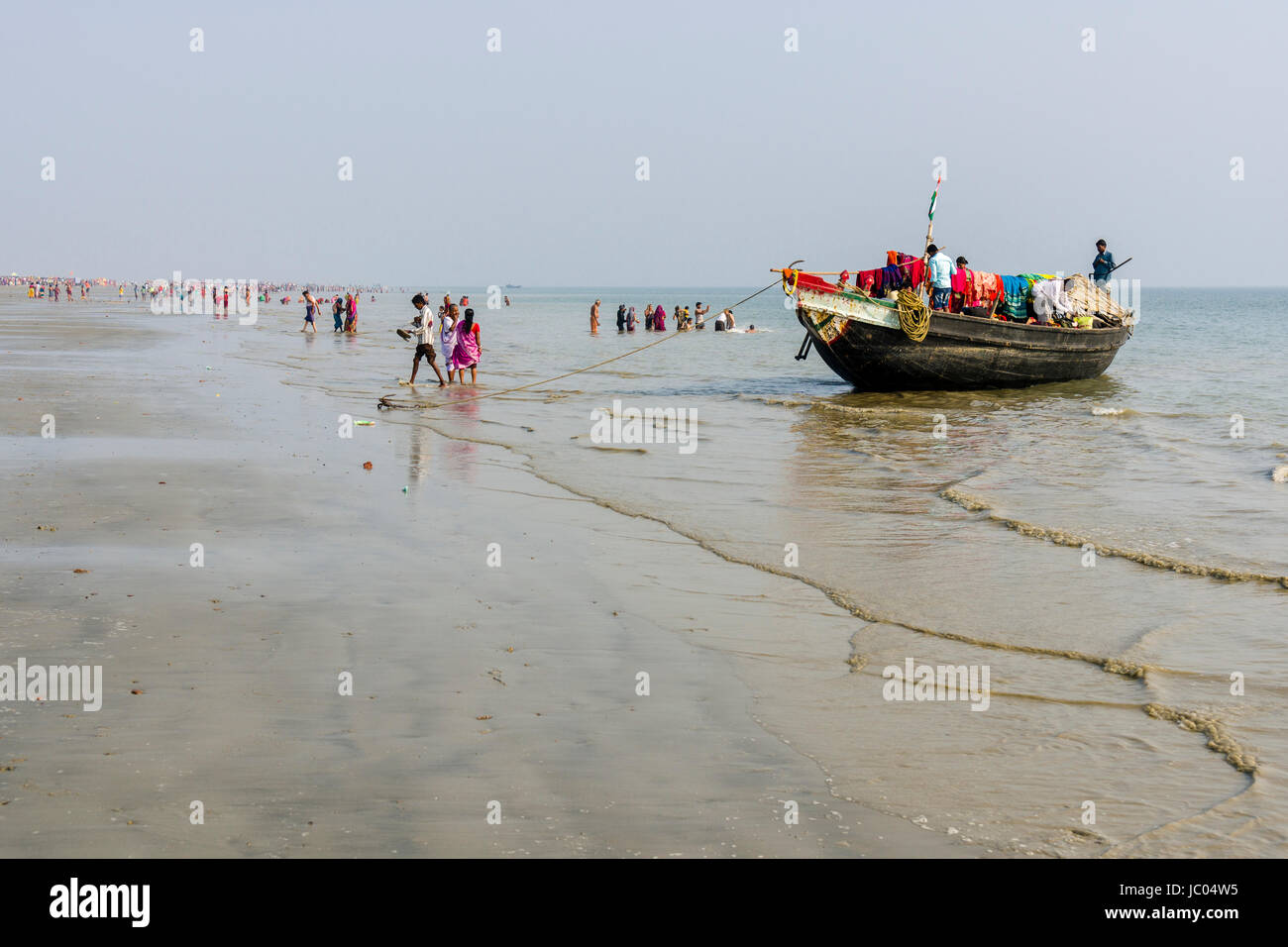 Hundreds of pilgrims are gathering on the beach of Ganga Sagar, celebrating Maghi Purnima festival Stock Photo