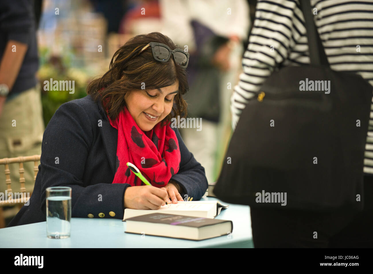 Sayeeda Warsi, Baroness Warsi lawyer & politician signing books for fans in the bookshop at the annual Hay Festival of Literature and the Arts 2017 Hay-on-Wye Powys Wales UK Stock Photo