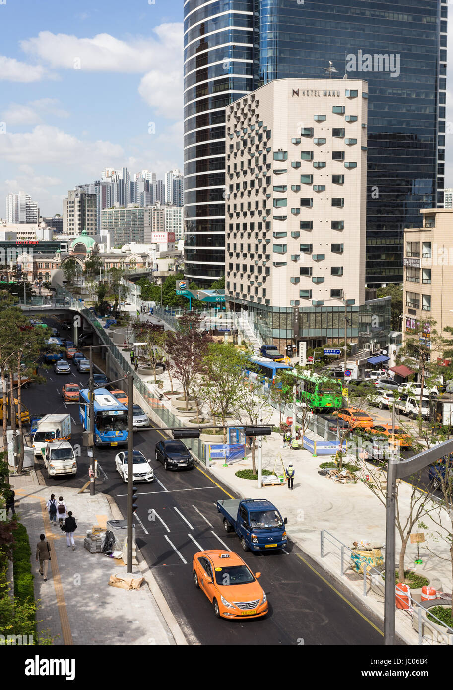 SEOUL, SOUTH KOREA - MAY 15: Cars and buses drive along the road leading to Seoul train station in the downtonw district of the South Korea capital ci Stock Photo