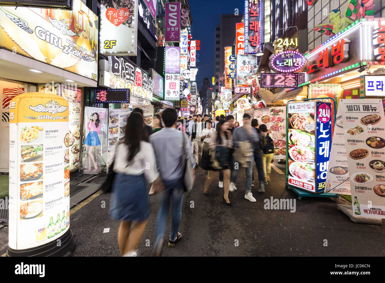 SEOUL, SOUTH KOREA - MAY 13: People, captured with blurred motion, wander in the street of the Insadong shopping and entertainment district lined with Stock Photo