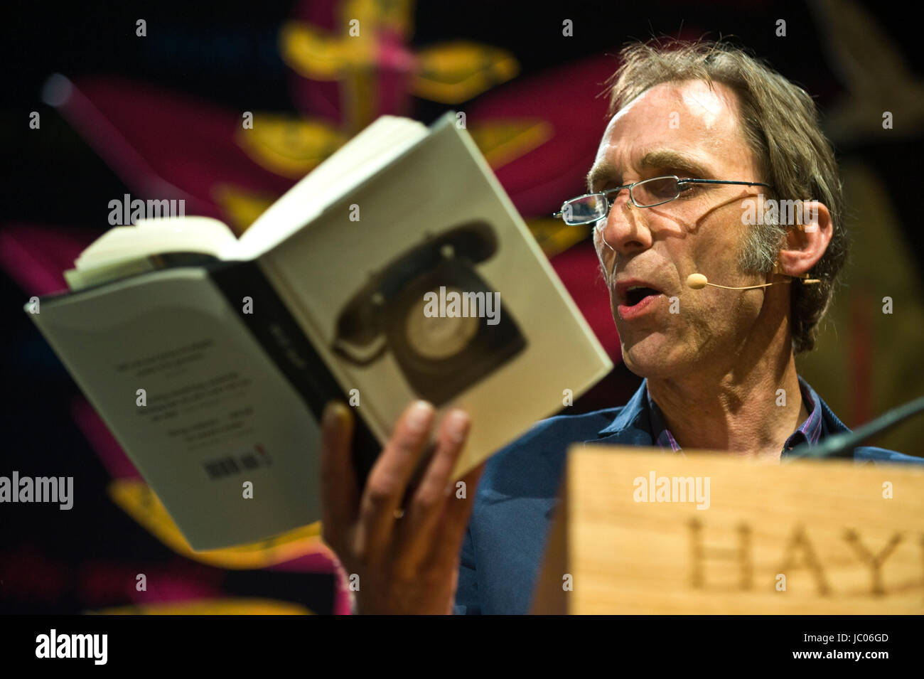 Will Self novelist reading from his novel Phone on stage at lectern during Hay Festival of Literature and the Arts 2017 Hay-on-Wye Powys Wales UK Stock Photo