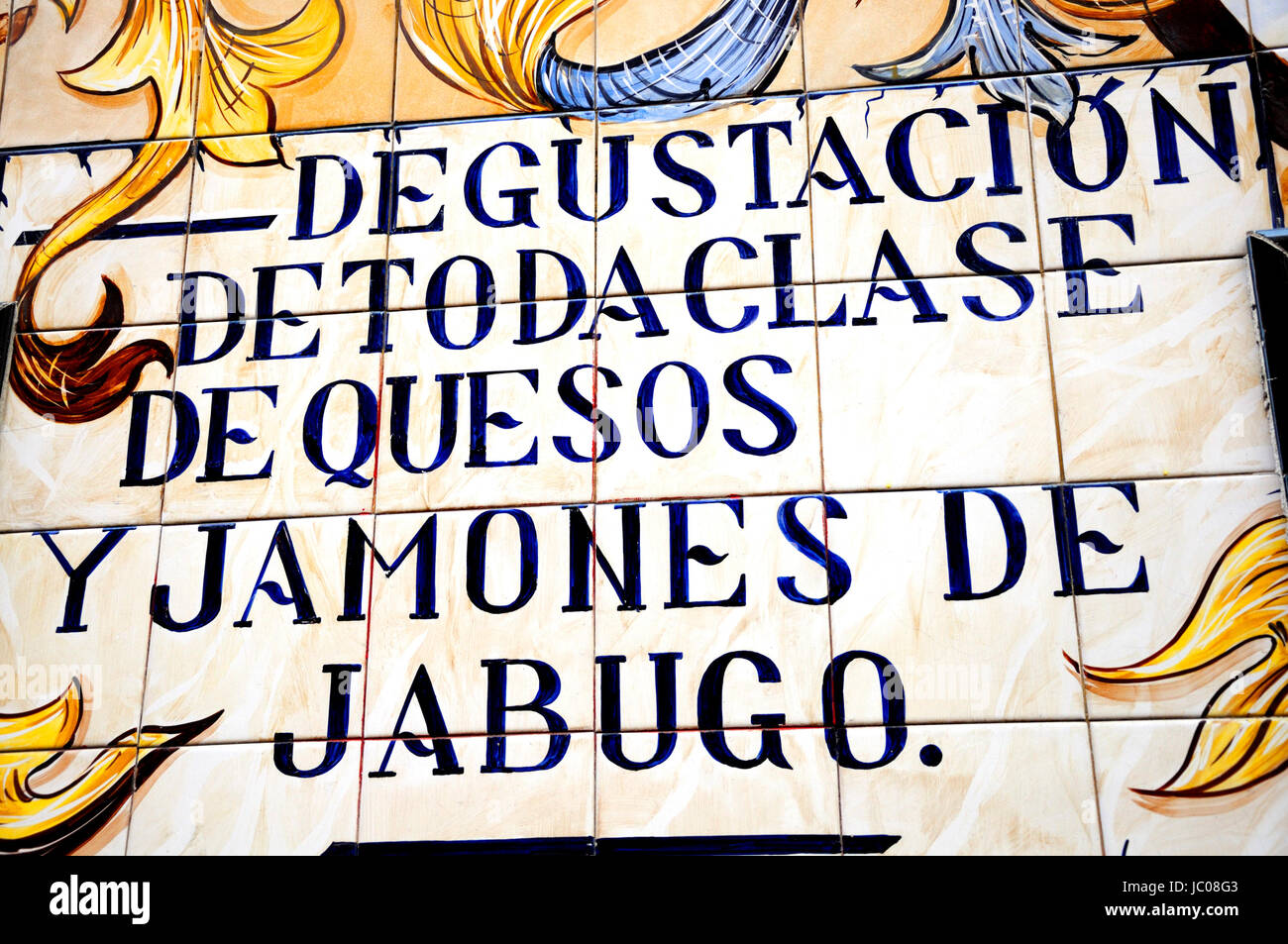 Madrid, Spain. La Chata Restaurant in Cava Baja. Famous Tiled Facade. Detail 'Tasting of all kinds of cheeses and Jabugo ham' Stock Photo