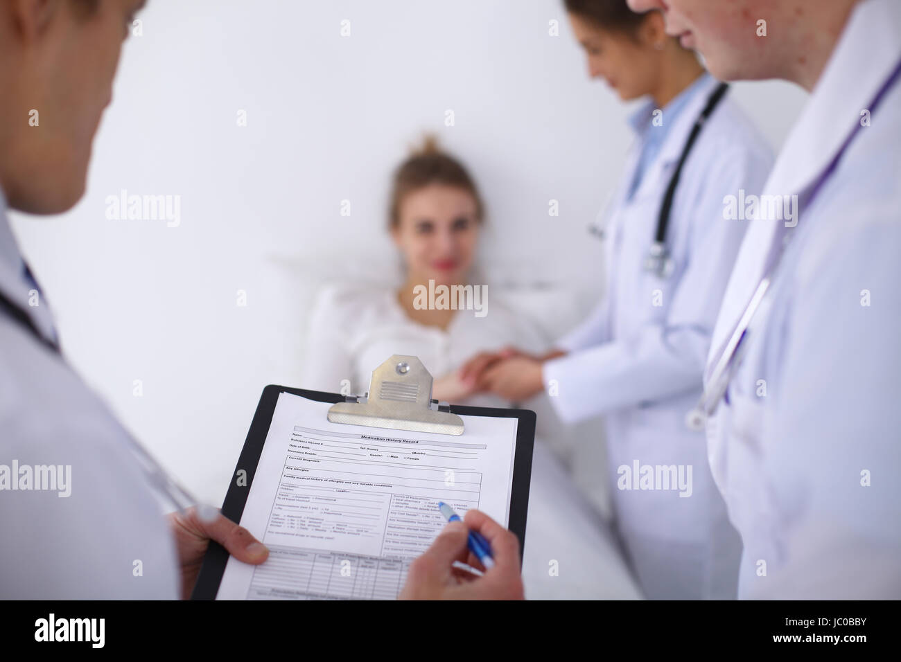 A group of doctors discussing medical history close up Stock Photo - Alamy