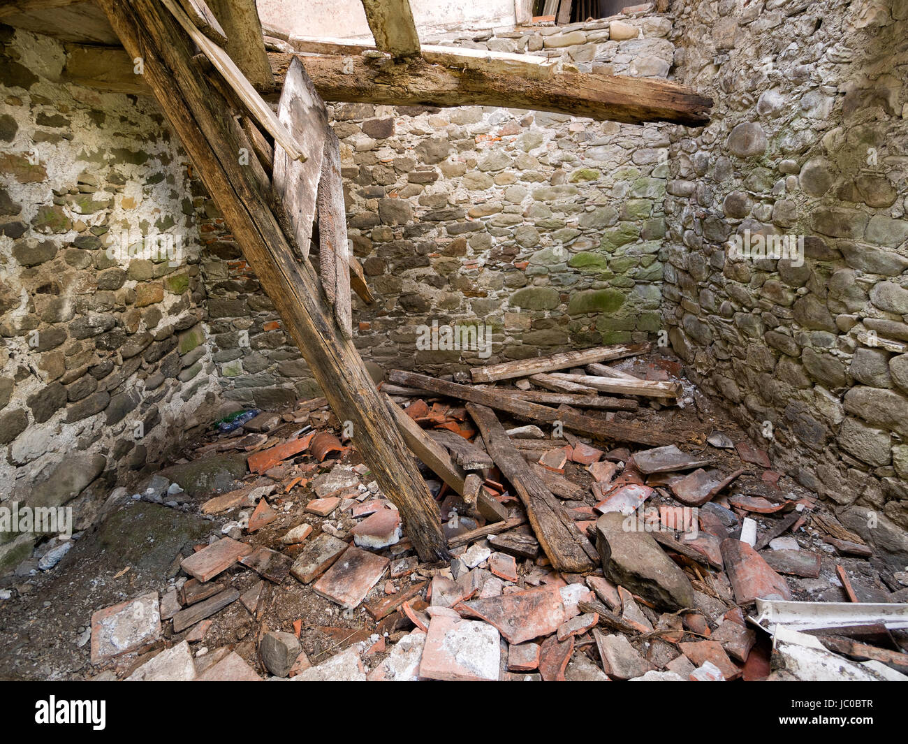 Roof caved in with debris. Only sky above Stock Photo Alamy