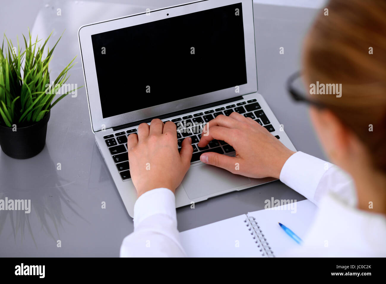 Close-up of Business woman is typing on laptop computer Stock Photo - Alamy