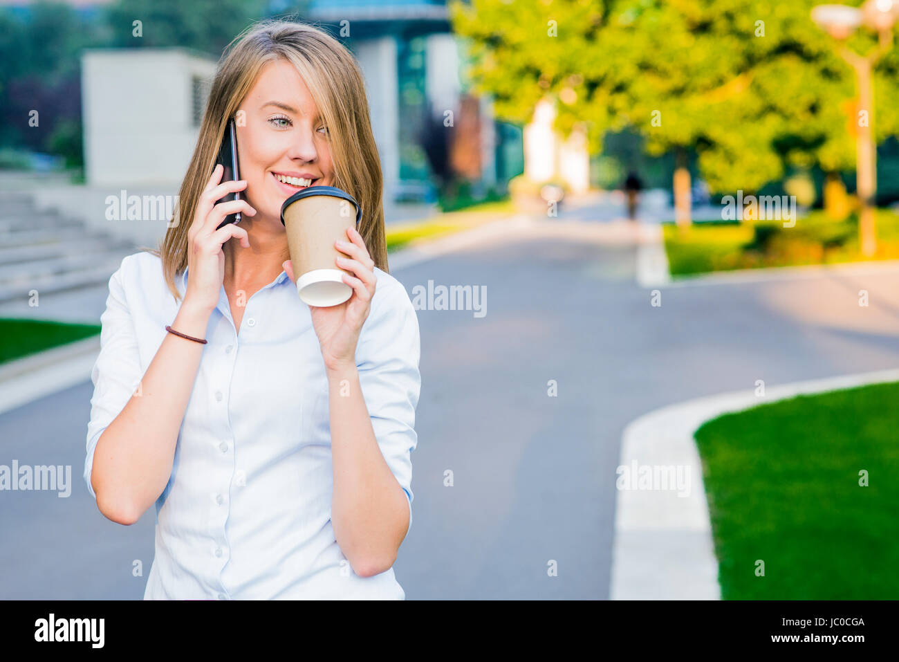 City lifestyle business woman using smartphone. Young professional female businesswoman on smart phone Stock Photo