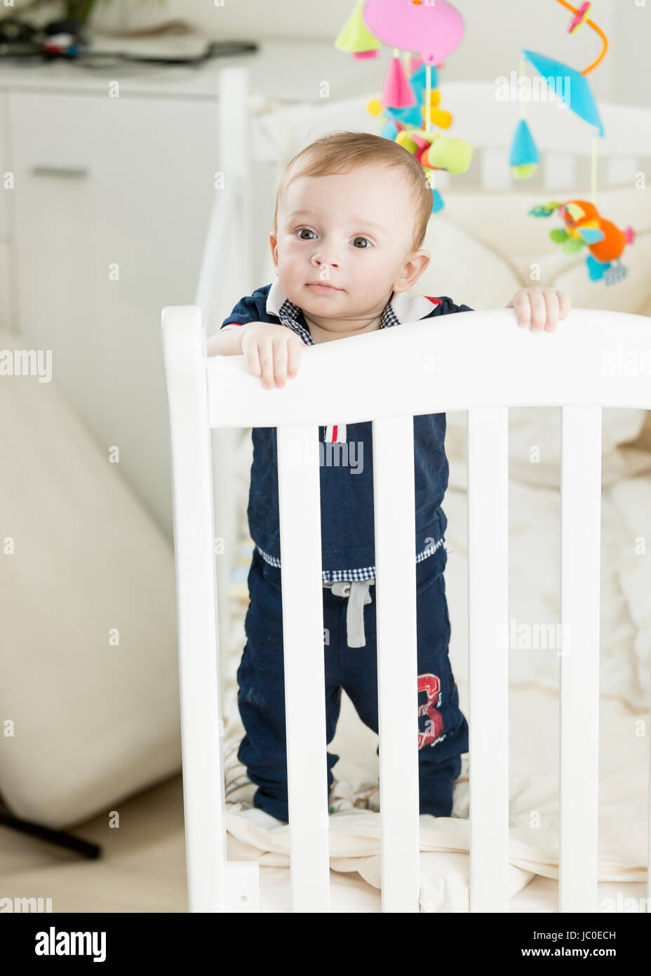 baby standing at 9 months
