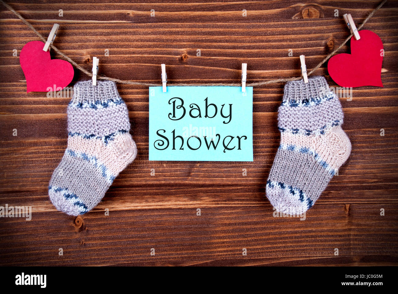 The Words Baby Shower on a Blue Label with Socks and Hears on a Line Stock Photo