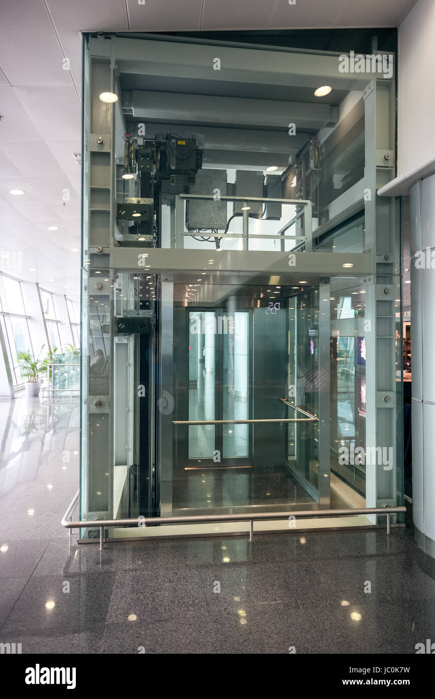 Interior shot of glass elevator at airport terminal Stock Photo