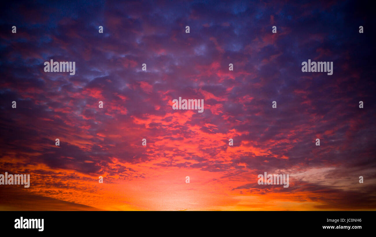 Beautiful orange and purple sky at sunset Stock Photo - Alamy