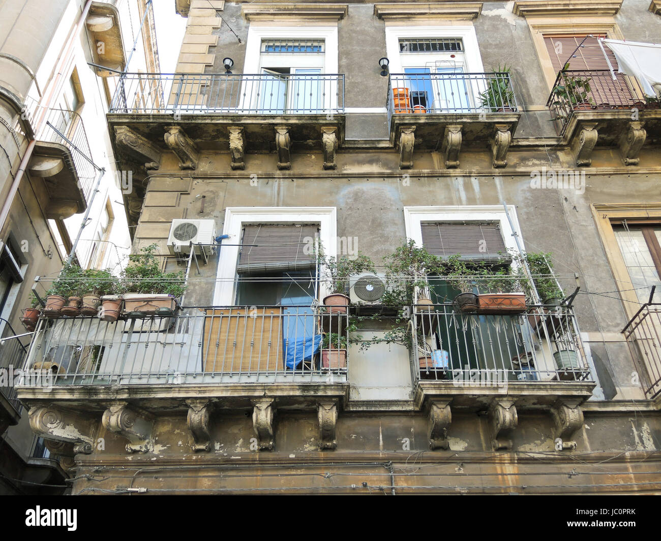 facade of an apartment building in the center of Catania, Sicily, Italy
