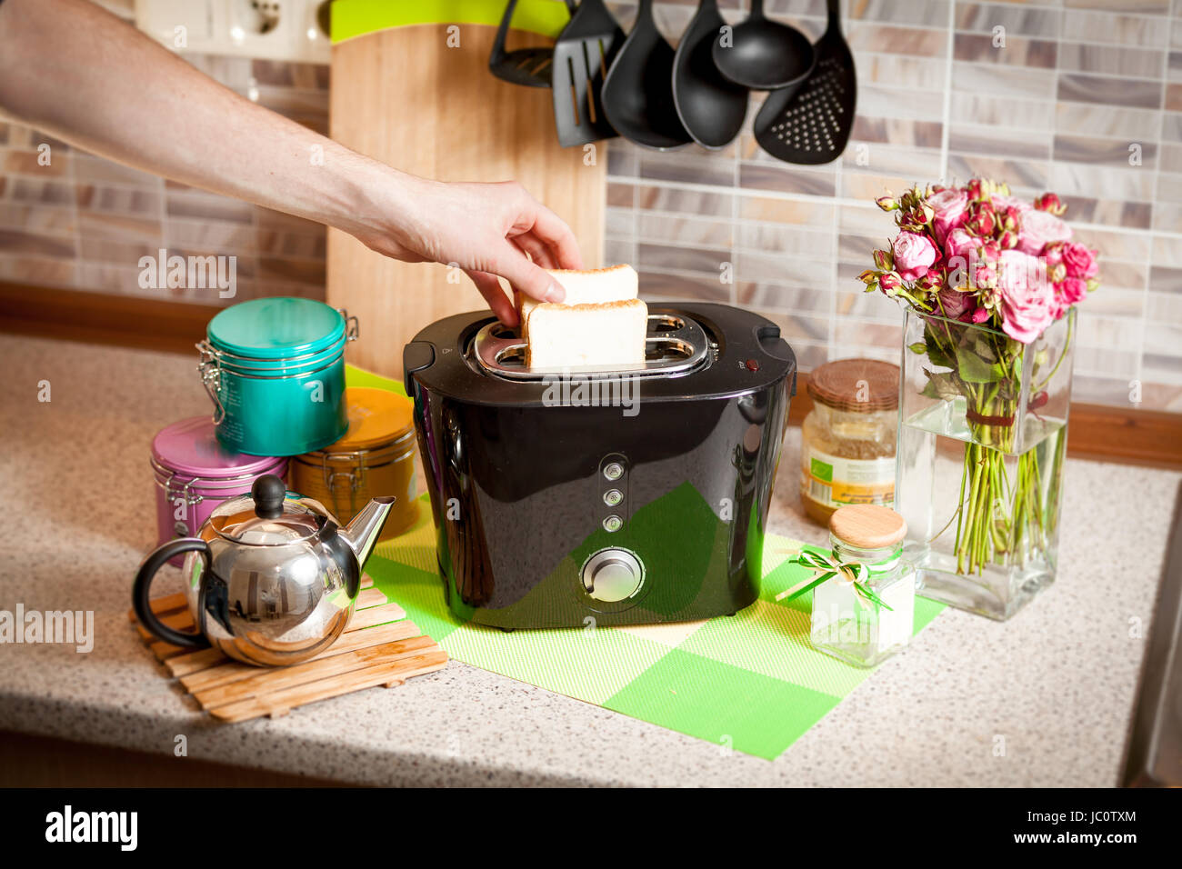 Putting toast in toaster hi-res stock photography and images - Alamy