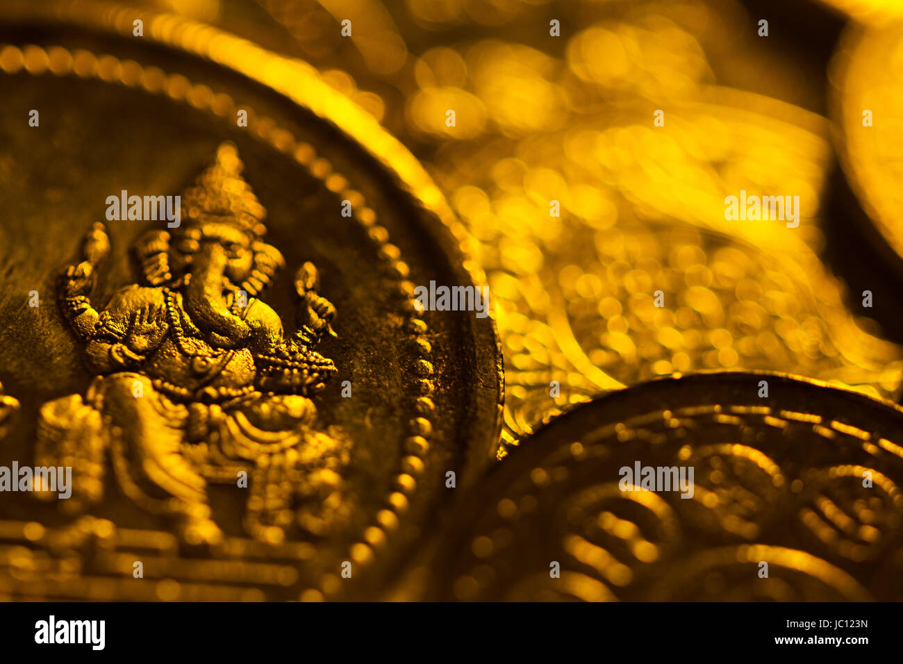Close-Up India Festival .Deepavali Abundance Silver Coin Ganapati Photo No-People Stock Photo