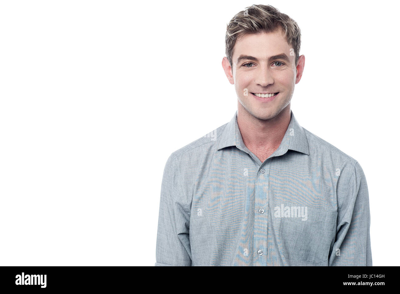Smiling young man isolated over white Stock Photo - Alamy