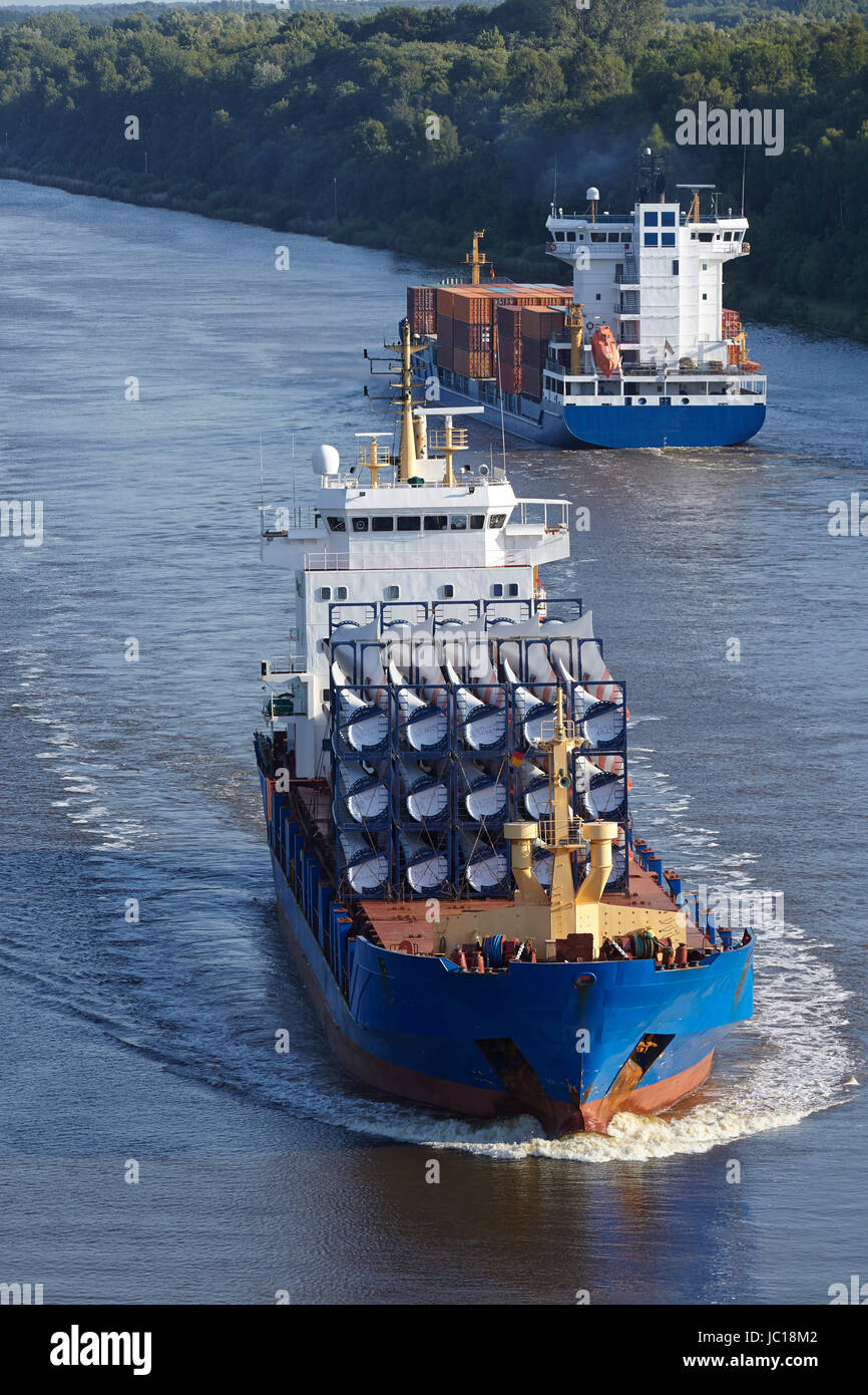 A cargo vessel loaded with rotor blades for wind turbines at the Kiel Canal near Beldorf