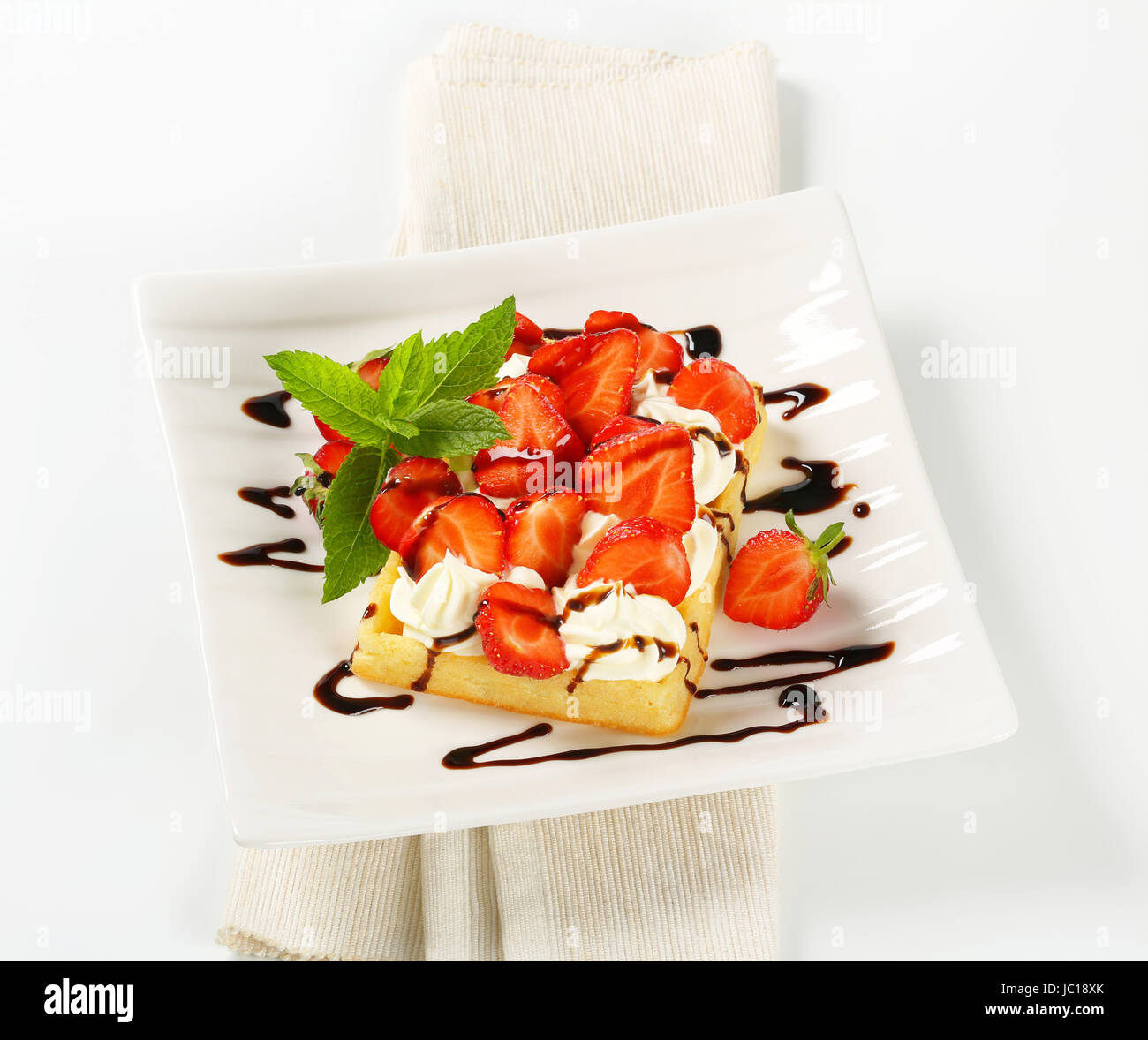 Belgian waffle with whipped cream and fresh strawberries Stock Photo ...