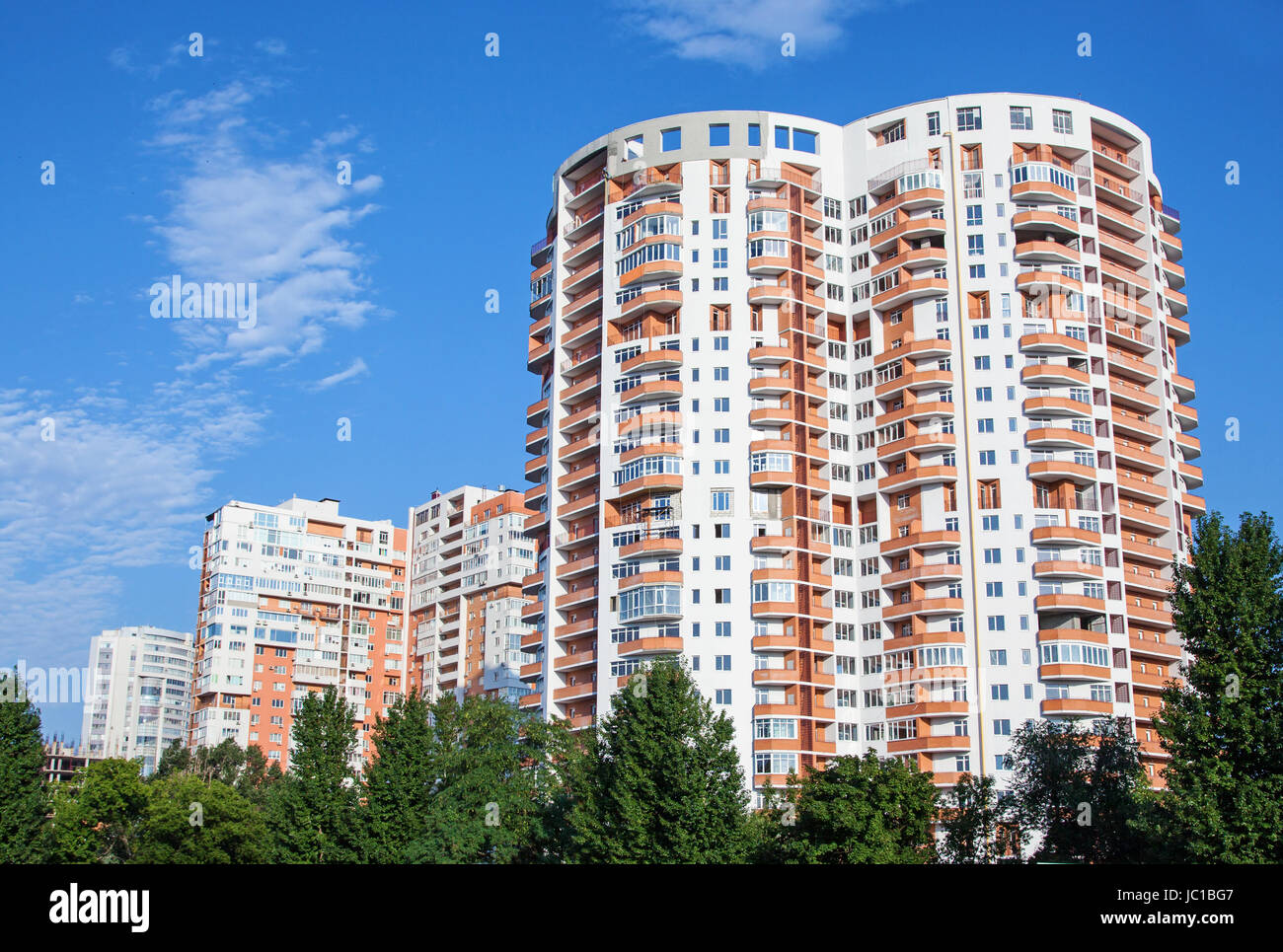 high residential building on a blue background Stock Photo - Alamy