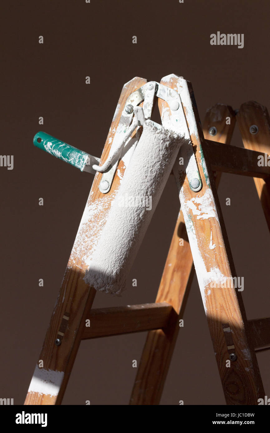 paint roller on ladder Stock Photo Alamy