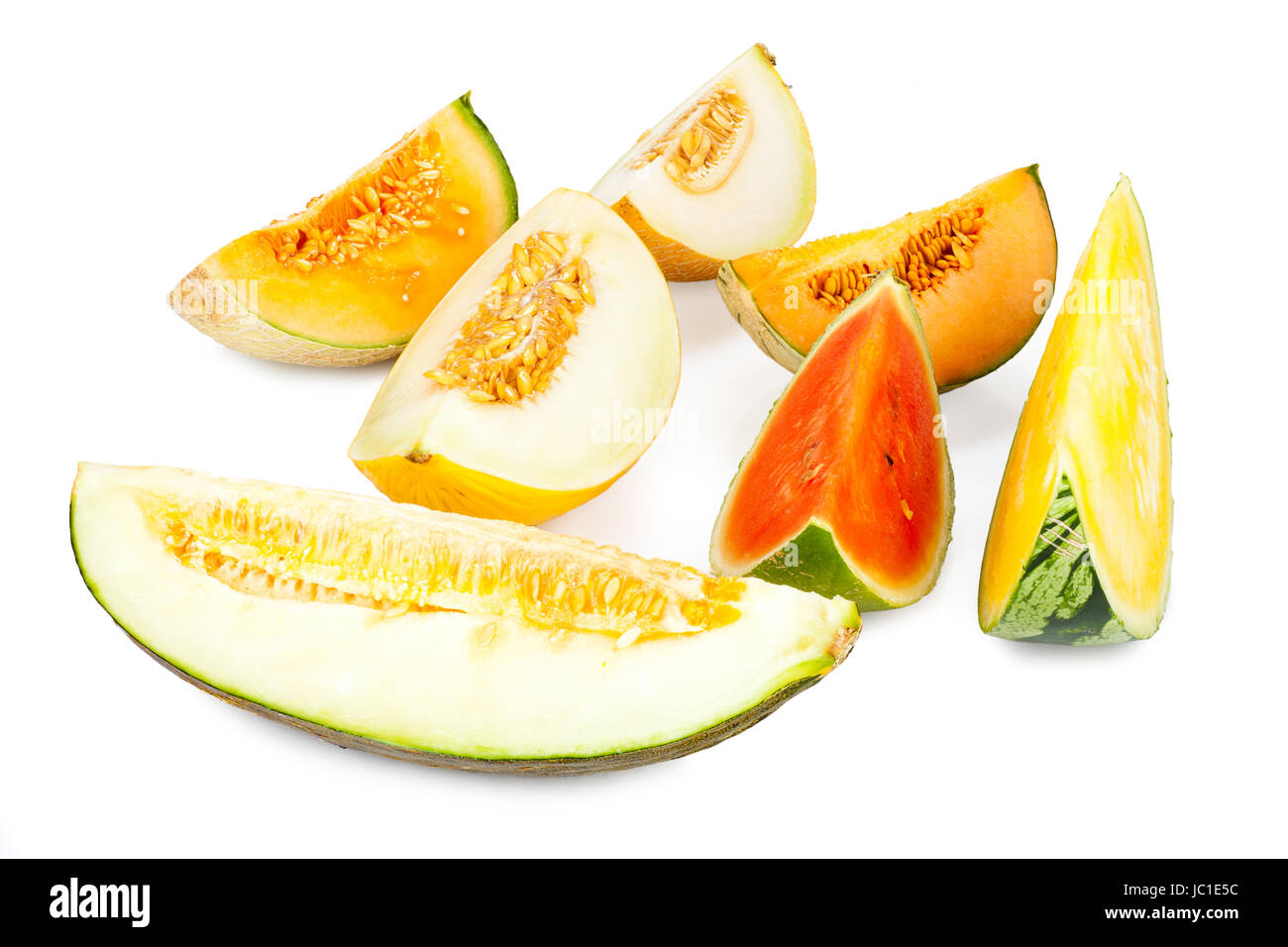 Stücke von verschiedenen Melonensorten vor weißem Hintergrund Stock Photo