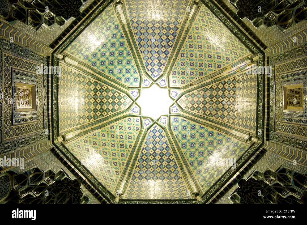 Sun illuminating the mosaic in the ceiling, Samarkand Stock Photo