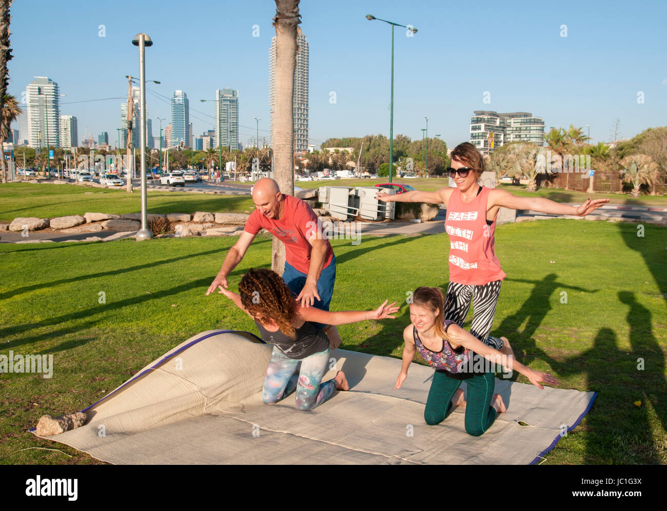 Acro Yoga practice session in Charles Clore Park on the Jaffa shore, Israel Stock Photo