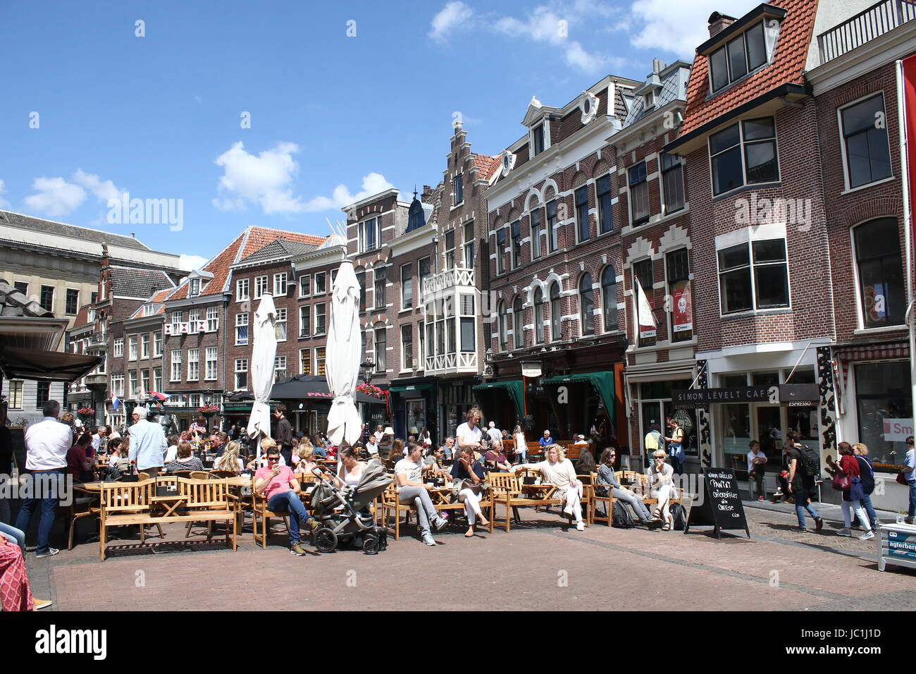 Busy terrace on a warm spring day at Vismarkt square, central Utrecht, The Netherlands. Stock Photo