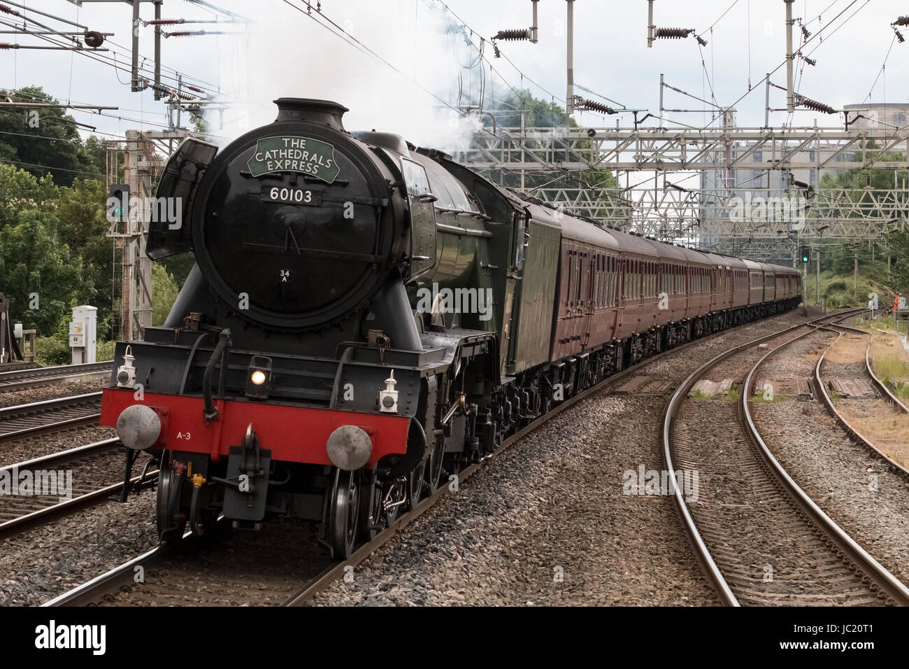 Rugeley, Staffordshire, UK. 13th Jun, 2017. Preserved British Rail A3 Pacific steam locomotive "Flying Scotsman" passes through Rugeley Trent Valley station working the Cathedrals Express railway charter from London Victoria to Chester, on the 13th June 2017. The locomotive is generally seen as the most famous steam engine in the world, having been the first steam locomotive to officially reach 100mph. Credit: Richard Holmes/Alamy Live News Stock Photo