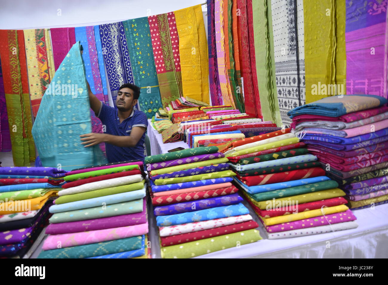 Dhaka, Bangladesh. 13th Jun, 2017. Bangladeshi shopkeeper displayed Jamdani Sari for sells in the exhibition at National Museum in Dhaka, Bangladesh, on June 13, 2017.The Jamdani Sari exhibition was organised by Bangladesh Small and Cottage Industries Corporation (BSCIC) at National Museum in Dhaka, Bangladesh from 13-23. Credit: Mamunur Rashid/Alamy Live News Stock Photo