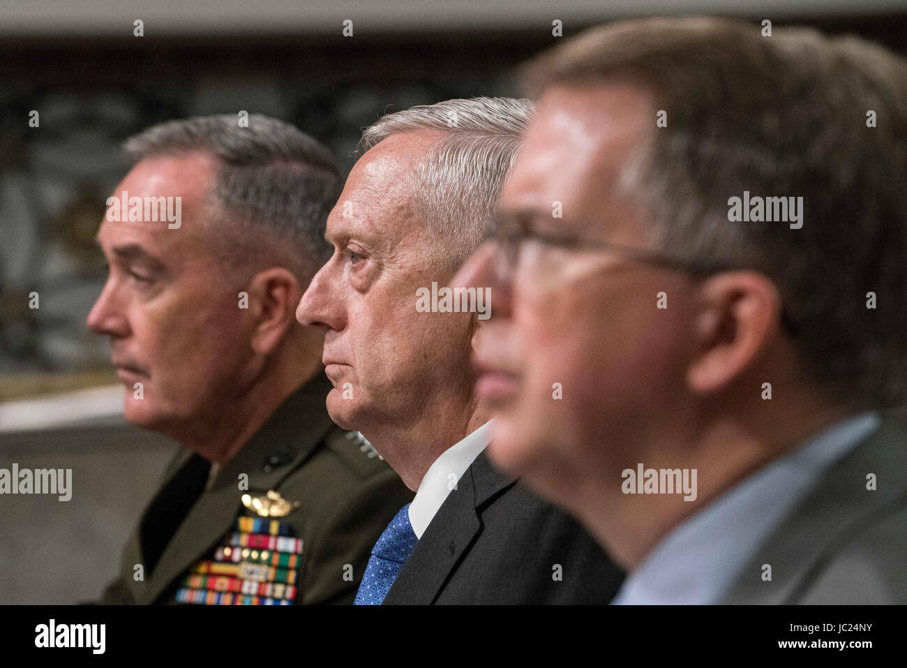Washington DC, USA. 13th June, 2017. Chairman of the Joint Chiefs of Staff General Joseph Dunford, Jr., (L), US Secretary of Defense James Mattis (C) and Under Secretary of Defense (Comptroller) and Chief Financial Officer David Norquist (R), testify during a US House Armed Services Committee hearing on the Fiscal Year 2018 budget on Capitol Hill in Washington. Credit: Ken Cedeno/ZUMA Wire/Alamy Live News Stock Photo