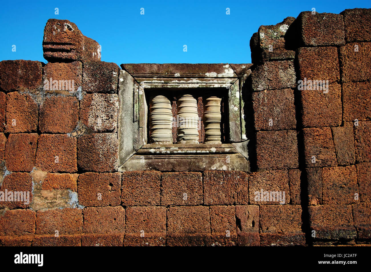 Window of an ancient stone wall in Angkor temple Stock Photo - Alamy