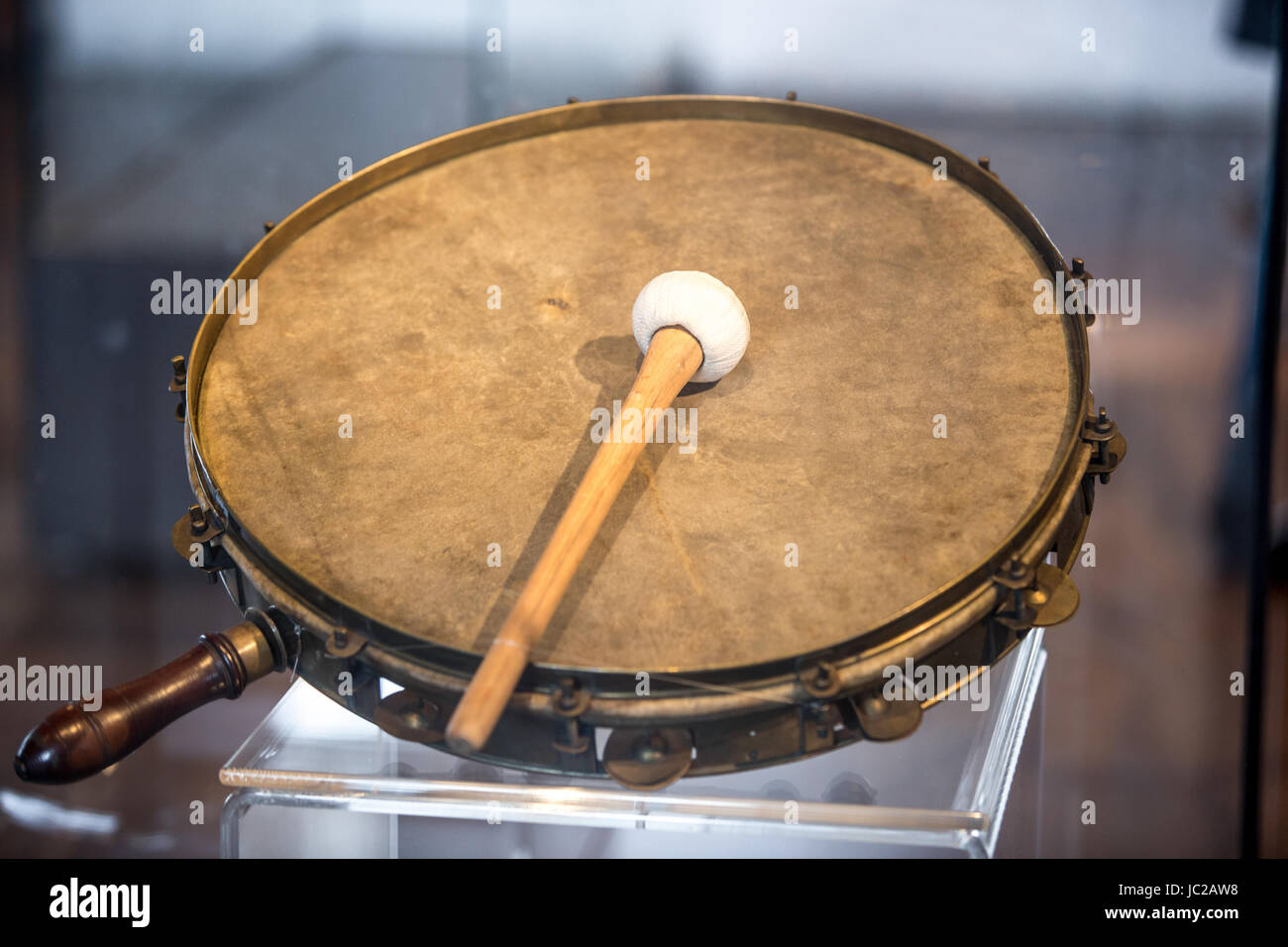 Closeup photo of old war tambourine with drumstick Stock Photo - Alamy