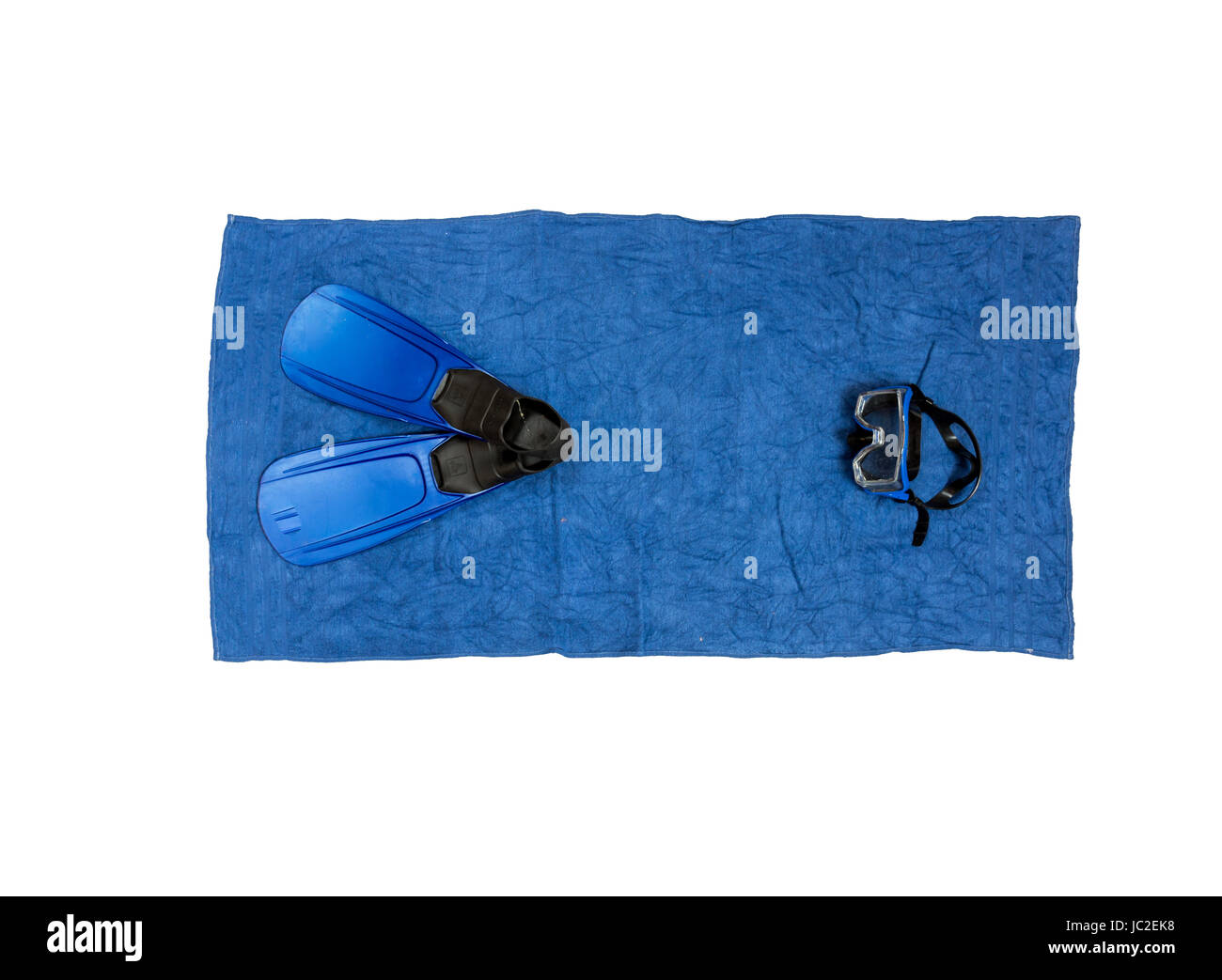 Top view shot of snorkeling equipment lying on blue beach towel Stock Photo