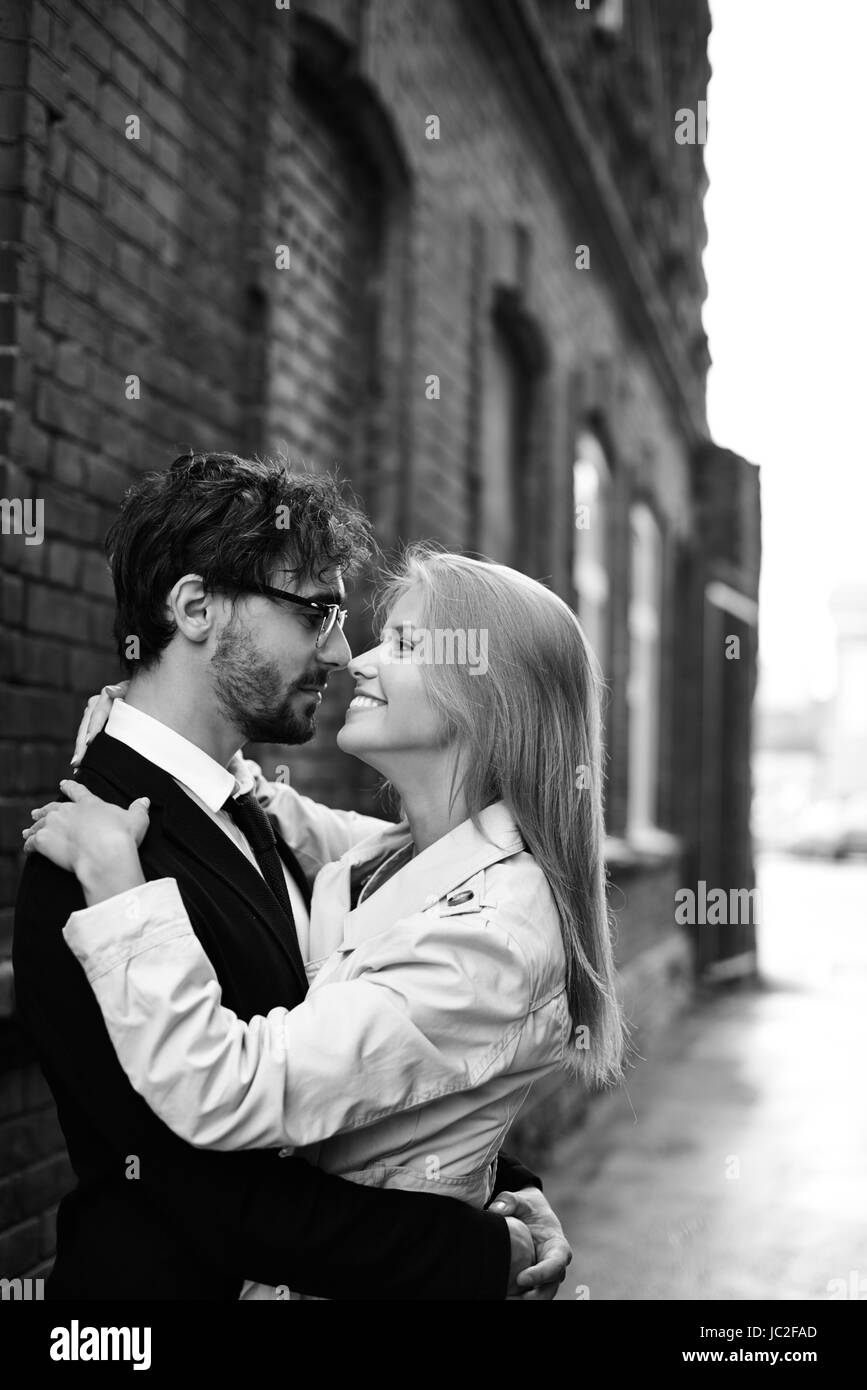 Portrait of amorous dates looking at one another outside Stock Photo