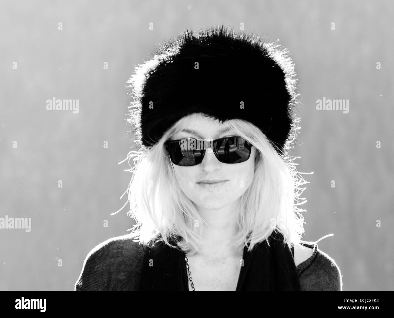Black and white shot of young blonde girl with russian hat Stock Photo