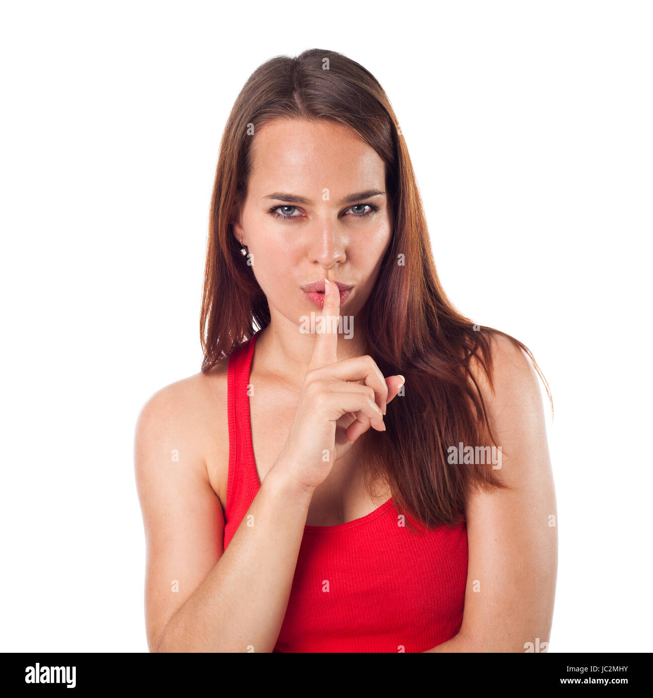 View of Beautiful young woman with her finger on her lips, expressing seduction ...