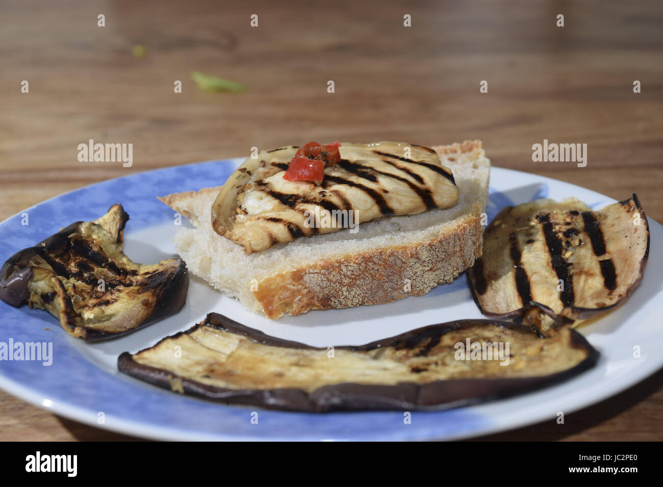 toasted bread seasoning with olive oil and roasted eggplants Stock