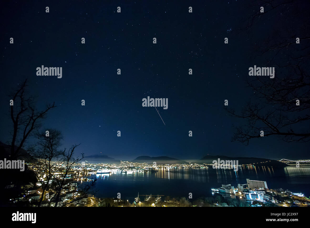 Bergen, Norway - December 12, 2015. Geminid meteor shower over city of Bergen, Norway. Stock Photo