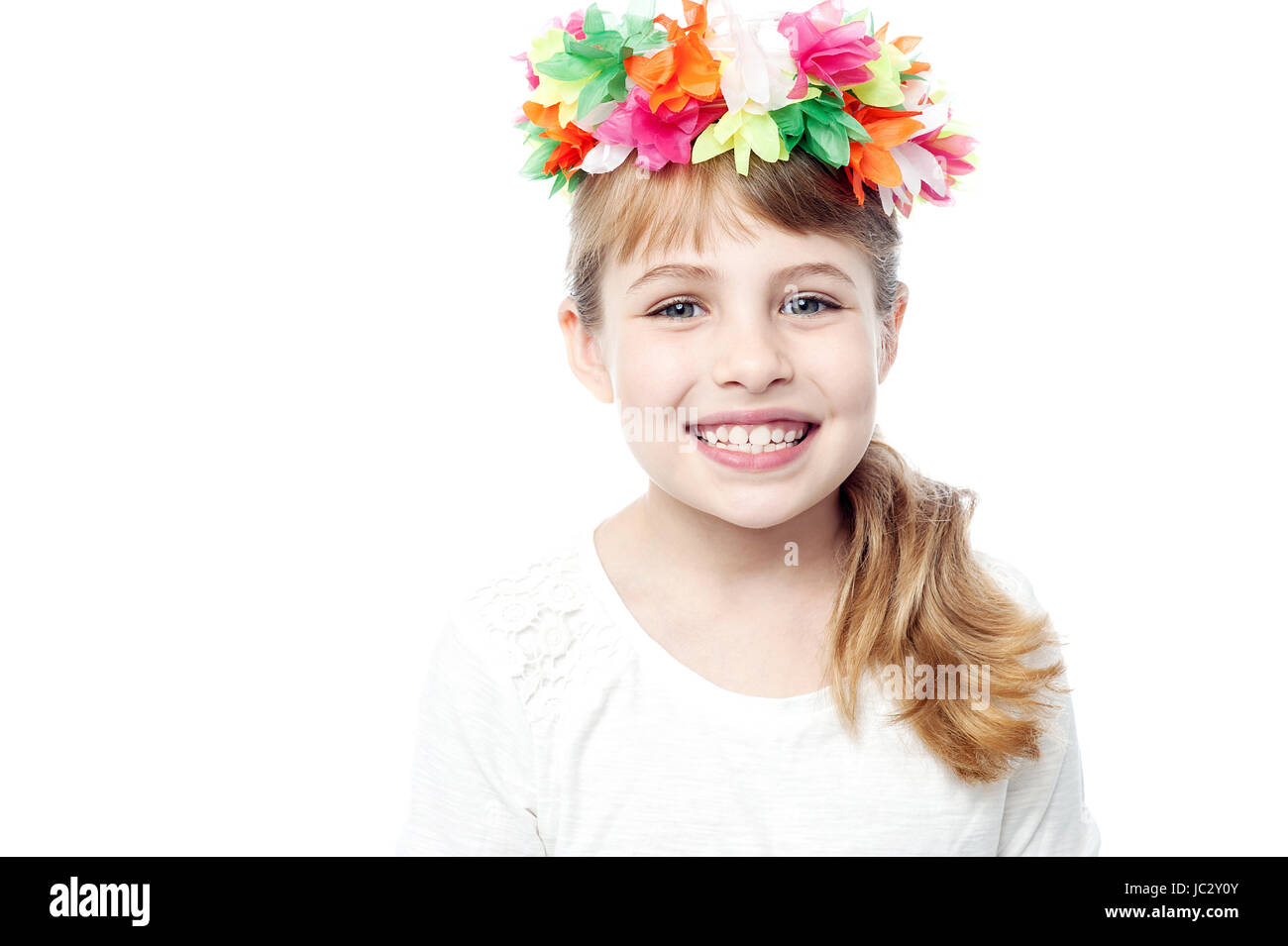 Smiling cute girl wearing flower wreath Stock Photo - Alamy