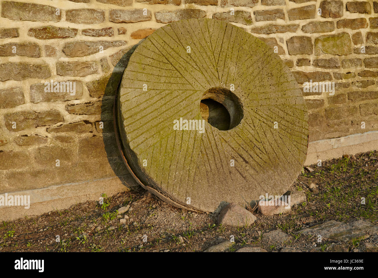 A mill wheel at the windmill Levern (Stemwede, Germany) taken just before sunset is part of the Westphalia Mill Street in the rural district Minden-Luebbecke. Stock Photo
