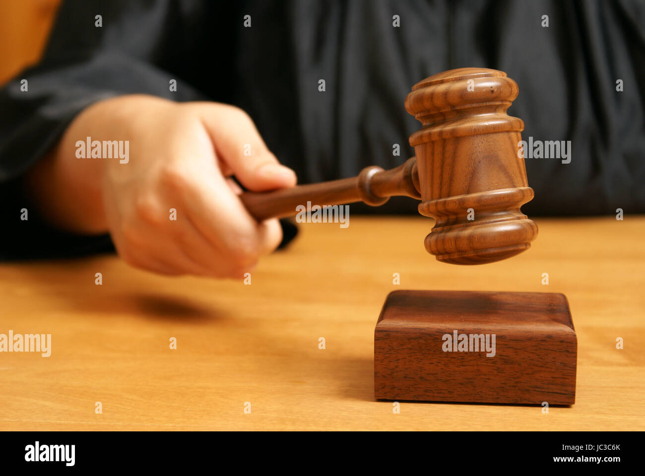 A professional judge declares the legal proceeding with a final hit ...